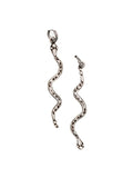 Pair of silver snake-shaped earrings on a white background