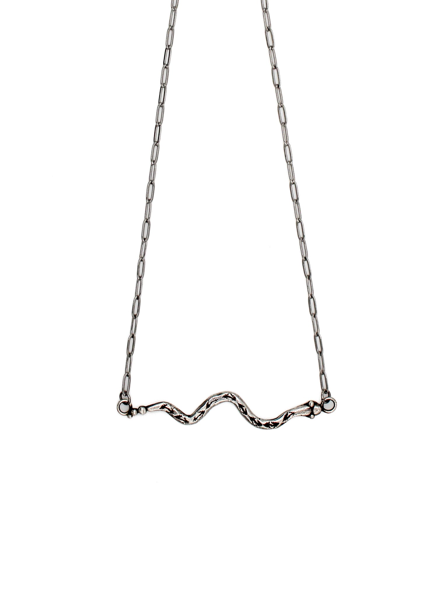 Silver necklace with a snake design on a white background 