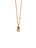 Gold necklace with a heart-shaped pendant on a white background