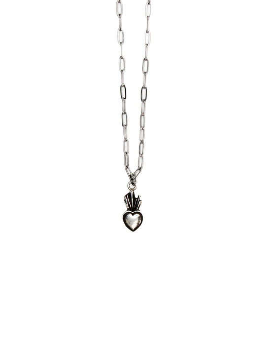 Silver necklace with a heart-shaped pendant on a white background