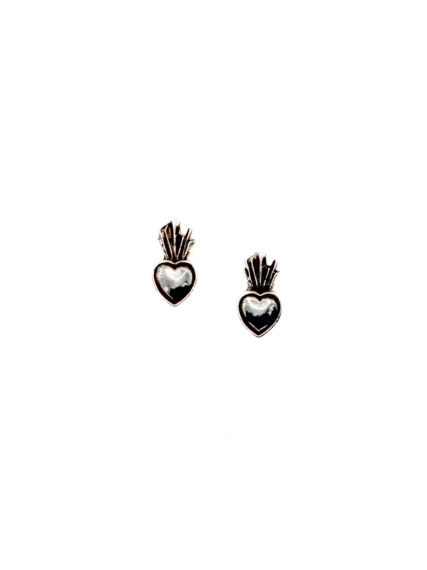 Heart-shaped earrings with intricate designs on a white background