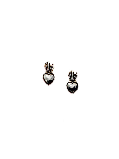 Heart-shaped earrings with intricate designs on a white background