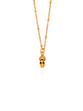Load image into Gallery viewer, Gold necklace with a skull pendant on a white background
