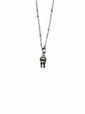 Skull pendant necklace on a white background