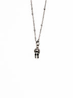 Skull pendant necklace on a white background