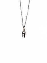 Load image into Gallery viewer, Skull pendant necklace on a white background
