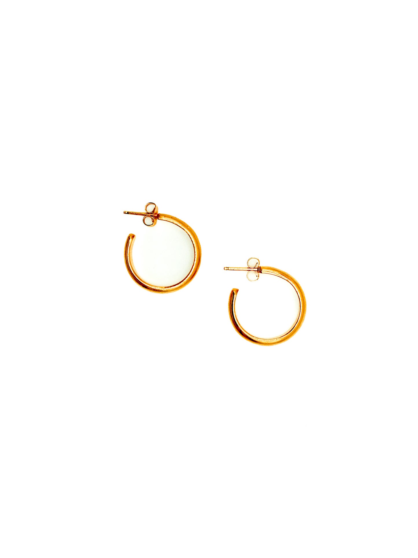 Gold hoop earrings on a white background
