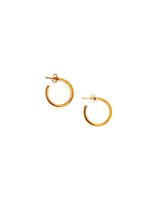 Gold hoop earrings on a white background